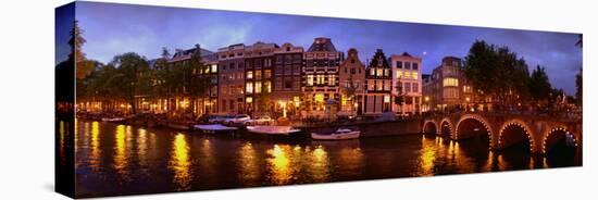 Buildings Along a Canal at Dusk, Amsterdam, Netherlands-null-Stretched Canvas