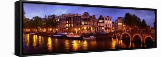 Buildings Along a Canal at Dusk, Amsterdam, Netherlands-null-Framed Stretched Canvas