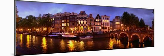 Buildings Along a Canal at Dusk, Amsterdam, Netherlands-null-Mounted Photographic Print