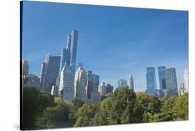 Buildings Along Central Park South Will Wollman Rink in Central Park, New York City, Ny-Greg Probst-Stretched Canvas