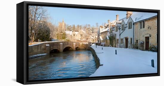 Buildings Along Snow Covered Street, Castle Combe, Wiltshire, England-null-Framed Stretched Canvas