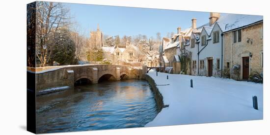 Buildings Along Snow Covered Street, Castle Combe, Wiltshire, England-null-Stretched Canvas