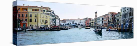 Buildings at the Waterfront, Rialto Bridge, Grand Canal, Venice, Veneto, Italy-null-Stretched Canvas