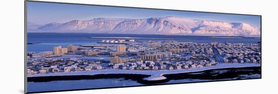 Buildings in a City with a Mountain in the Background, Mt Esja, Reykjavik, Iceland-null-Mounted Photographic Print