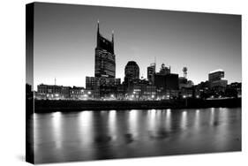 Buildings lit up at dusk at the waterfront, Cumberland River, Bell South Tower, Nashville, Tenne...-null-Stretched Canvas