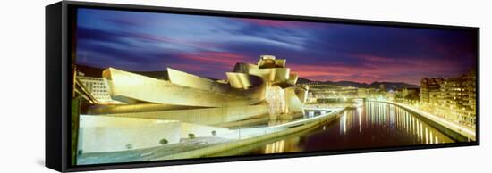 Buildings Lit Up at Dusk, Guggenheim Museum Bilbao, Bilbao, Vizcaya, Spain-null-Framed Stretched Canvas