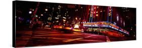 Buildings Lit Up at Night, Radio City Music Hall, Rockefeller Center, Manhattan, New York, USA-null-Stretched Canvas