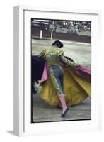 Bullfighter Manuel Benitez, Known as "El Cordobes," Sweeping His Cape Aside a Charging Bull-Loomis Dean-Framed Photographic Print