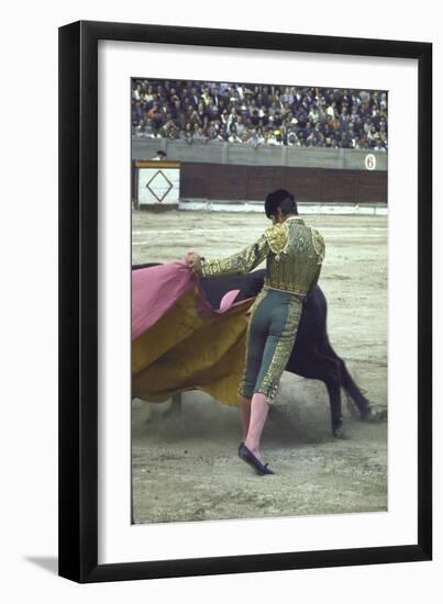 Bullfighter Manuel Benitez, Known as "El Cordobes," Sweeping His Cape Aside the Charging Bull-Loomis Dean-Framed Photographic Print