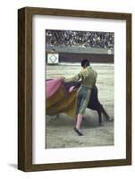 Bullfighter Manuel Benitez, Known as "El Cordobes," Sweeping His Cape Aside the Charging Bull-Loomis Dean-Framed Photographic Print