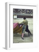 Bullfighter Manuel Benitez, Known as "El Cordobes," Sweeping His Cape Aside the Charging Bull-Loomis Dean-Framed Photographic Print