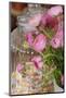 bunch of buttercups and candy necklaces in storage jar, Ranunculus asiaticus, close-up-Sandra Gutekunst-Mounted Photographic Print