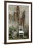 Bunches of Onions Drying Out on Brick Wall with Chair-Christina Wilson-Framed Photo