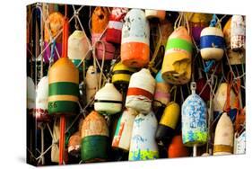 Buoys on a Wall at Apalachicola, Florida, USA-Joanne Wells-Stretched Canvas