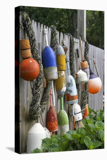 Buoys outside Lucy J's Jewelry and Glass Studio, Eastham, Cape Cod, Massachusetts, USA-Susan Pease-Stretched Canvas