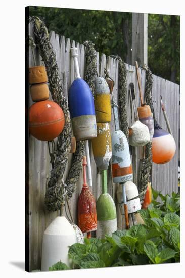 Buoys outside Lucy J's Jewelry and Glass Studio, Eastham, Cape Cod, Massachusetts, USA-Susan Pease-Stretched Canvas