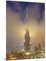 Burj Khalifa Illuminates the Clouds and Surrounding Skyline at Night, Downtown, Dubai, Uae-Amanda Hall-Mounted Photographic Print