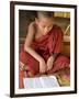 Burma, Lake Inle, A Young Novice Monk Learning at a Monastery School on Lake Inle, Myanmar-Nigel Pavitt-Framed Premium Photographic Print