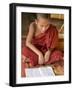 Burma, Lake Inle, A Young Novice Monk Learning at a Monastery School on Lake Inle, Myanmar-Nigel Pavitt-Framed Photographic Print