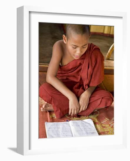 Burma, Lake Inle, A Young Novice Monk Learning at a Monastery School on Lake Inle, Myanmar-Nigel Pavitt-Framed Photographic Print