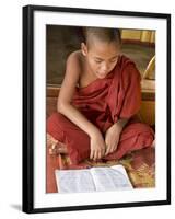 Burma, Lake Inle, A Young Novice Monk Learning at a Monastery School on Lake Inle, Myanmar-Nigel Pavitt-Framed Photographic Print