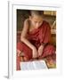 Burma, Lake Inle, A Young Novice Monk Learning at a Monastery School on Lake Inle, Myanmar-Nigel Pavitt-Framed Photographic Print