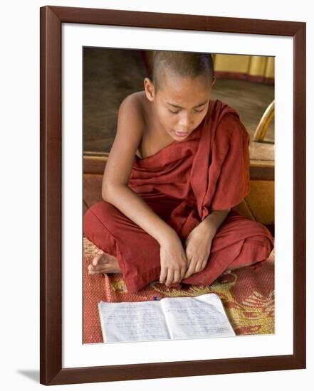 Burma, Lake Inle, A Young Novice Monk Learning at a Monastery School on Lake Inle, Myanmar-Nigel Pavitt-Framed Photographic Print