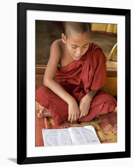 Burma, Lake Inle, A Young Novice Monk Learning at a Monastery School on Lake Inle, Myanmar-Nigel Pavitt-Framed Photographic Print