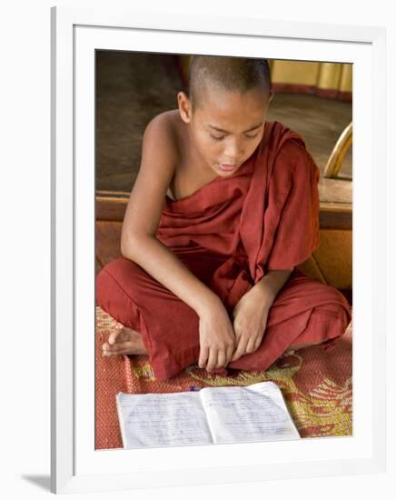 Burma, Lake Inle, A Young Novice Monk Learning at a Monastery School on Lake Inle, Myanmar-Nigel Pavitt-Framed Photographic Print