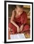 Burma, Lake Inle, A Young Novice Monk Learning at a Monastery School on Lake Inle, Myanmar-Nigel Pavitt-Framed Photographic Print