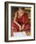 Burma, Lake Inle, A Young Novice Monk Learning at a Monastery School on Lake Inle, Myanmar-Nigel Pavitt-Framed Photographic Print