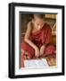 Burma, Lake Inle, A Young Novice Monk Learning at a Monastery School on Lake Inle, Myanmar-Nigel Pavitt-Framed Photographic Print