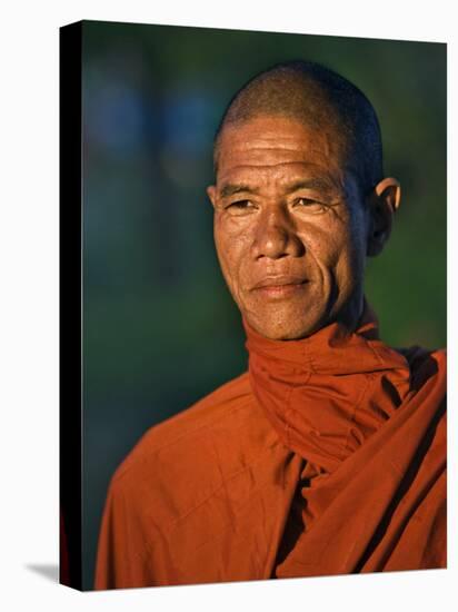 Burma, Rakhine State, A Buddhist Monk Enjoys the Late Afternoon at Sittwe, Myanmar-Nigel Pavitt-Stretched Canvas