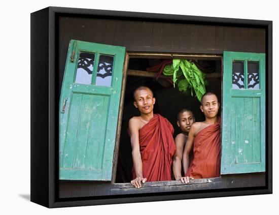 Burma, Rakhine State, Sittwe, Three Novice Monks Look Out of their Dormitory Window at the Pathain -Nigel Pavitt-Framed Stretched Canvas