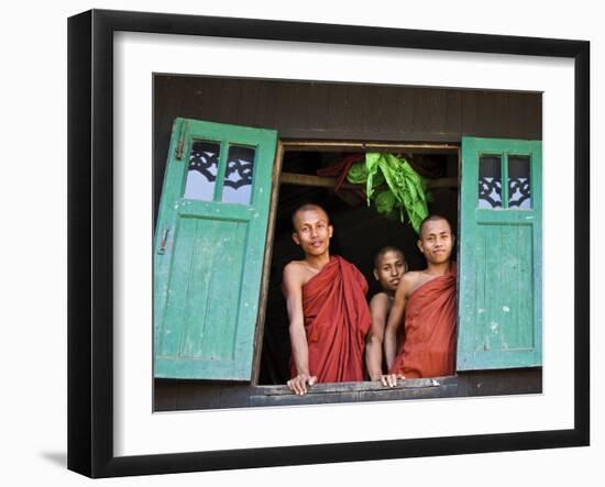 Burma, Rakhine State, Sittwe, Three Novice Monks Look Out of their Dormitory Window at the Pathain -Nigel Pavitt-Framed Photographic Print