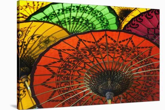 Burmese Parasols-Jon Hicks-Stretched Canvas