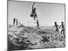 Bushman Children Playing Games on Sand Dunes-null-Mounted Photographic Print