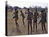 Bushmen or San Hunter-Gatherers Pause to Check a Distant Wild Animal in the Early Morning, Namibia-Nigel Pavitt-Stretched Canvas