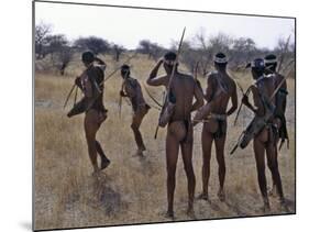 Bushmen or San Hunter-Gatherers Pause to Check a Distant Wild Animal in the Early Morning, Namibia-Nigel Pavitt-Mounted Photographic Print