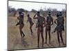 Bushmen or San Hunter-Gatherers Pause to Check a Distant Wild Animal in the Early Morning, Namibia-Nigel Pavitt-Mounted Photographic Print