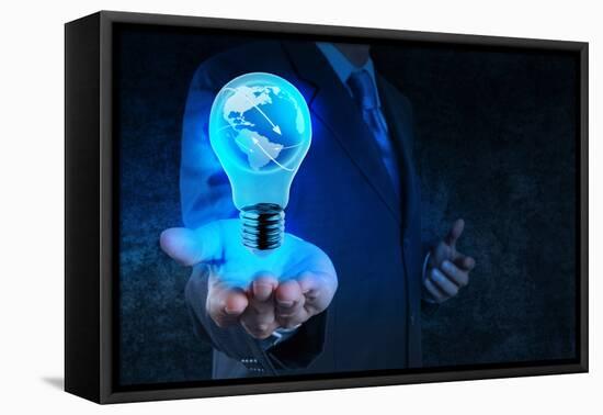 Businessman Hand Shows Light Bulb with Planet Earth Social Network-everythingpossible-Framed Stretched Canvas