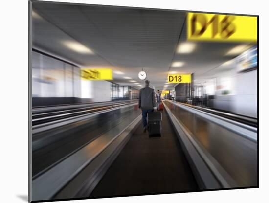 Businessman with Luggage on Travelator at Schiphol Airport, Amsterdam, Netherlands, Europe-Purcell-Holmes-Mounted Photographic Print