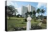 Bust of George V, Jubilee Park, on the Background the Sheraton Hotel, Uganda, Kampala-null-Stretched Canvas