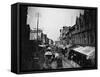Bustling View of Fulton St, with Rows of Shops and Horse Drawn Carriages-Wallace G^ Levison-Framed Stretched Canvas