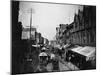 Bustling View of Fulton St, with Rows of Shops and Horse Drawn Carriages-Wallace G^ Levison-Mounted Photographic Print
