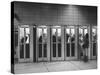 Busy Telephone Booths During an Airline Strike-Robert W^ Kelley-Stretched Canvas