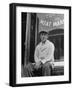 Butcher Taking a Break, Sitting in Front of Meat Market-Ed Clark-Framed Photographic Print