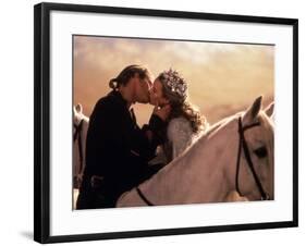 Buttercup and Westley Kissing on Horseback-null-Framed Photo