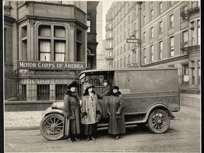 Four Women of the Motor Corps of America Standing in Front of an Ambulance (One Woman in Driver's…