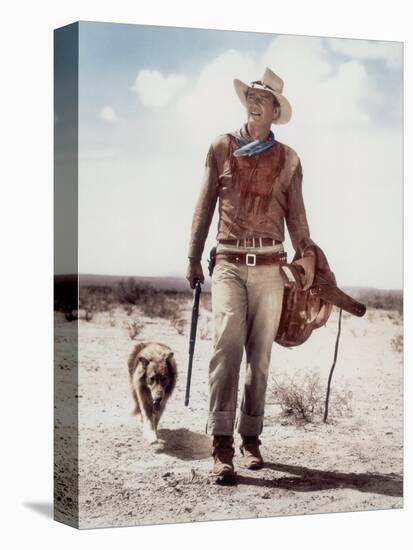 ca., 1953 --- Actor John Wayne on the movie set of "Hondo" (Hondo, L'Homme du Desert), directed by-null-Stretched Canvas